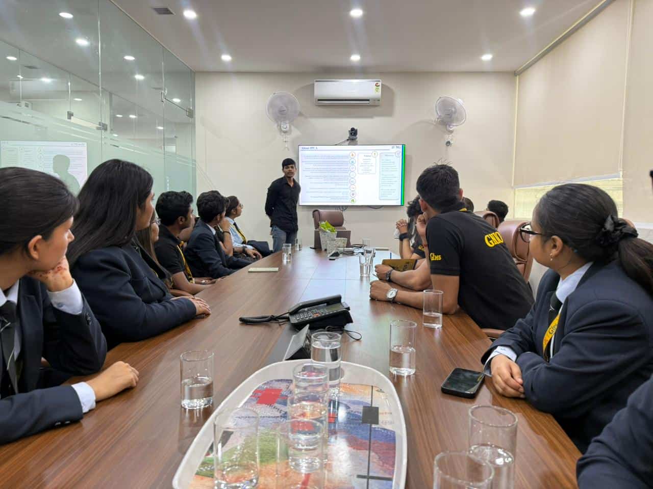 Interns discussing the campaign around a table