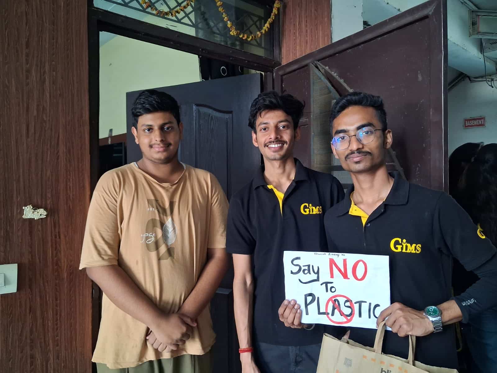 Students holding a Say No to Plastic message